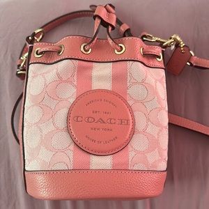 Coach brand new crossbody bag with pink straps